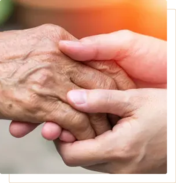 Group 1321317543 (1) A person holding an elderly hand in their hands.