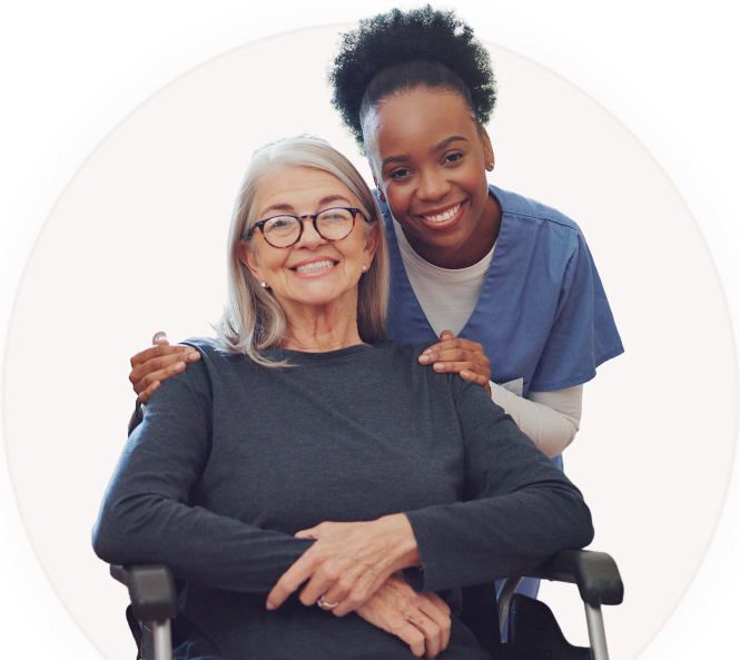h2 (1) Caregiver smiling with older woman in wheelchair.